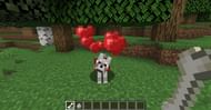 Successfully taming a wolf in Minecraft. (Image via Minecraft)